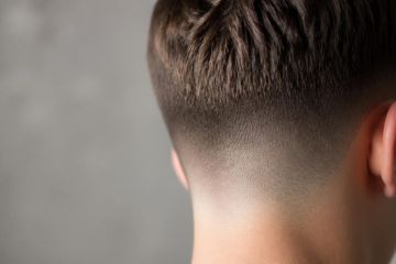 Nuque dégradée vue de dos montrant la transition progressive d’une coupe courte